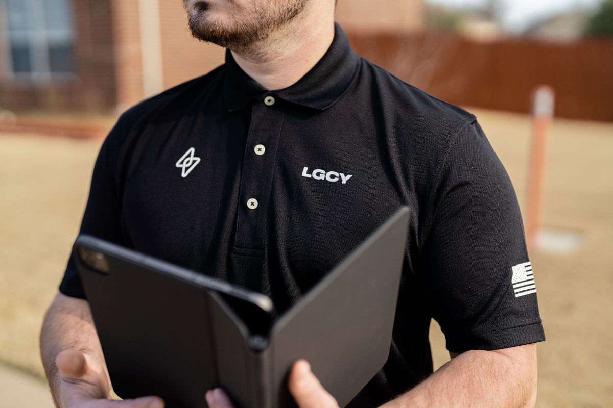 A LGCY Solar Sales rep holding the tablet