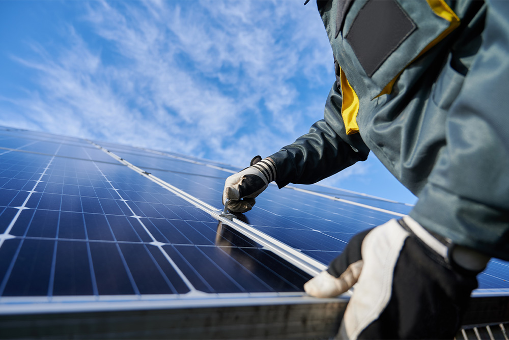 Person inspecting solar panels