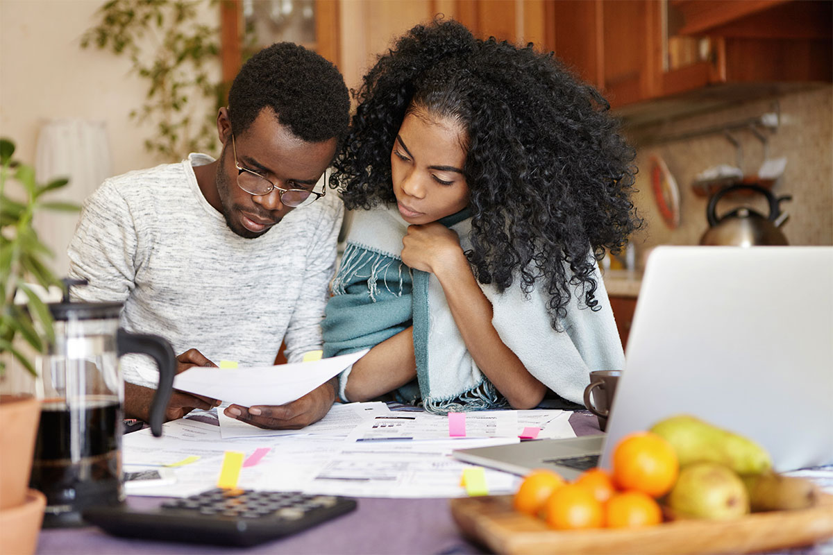 Young couple reviewing their electric bill