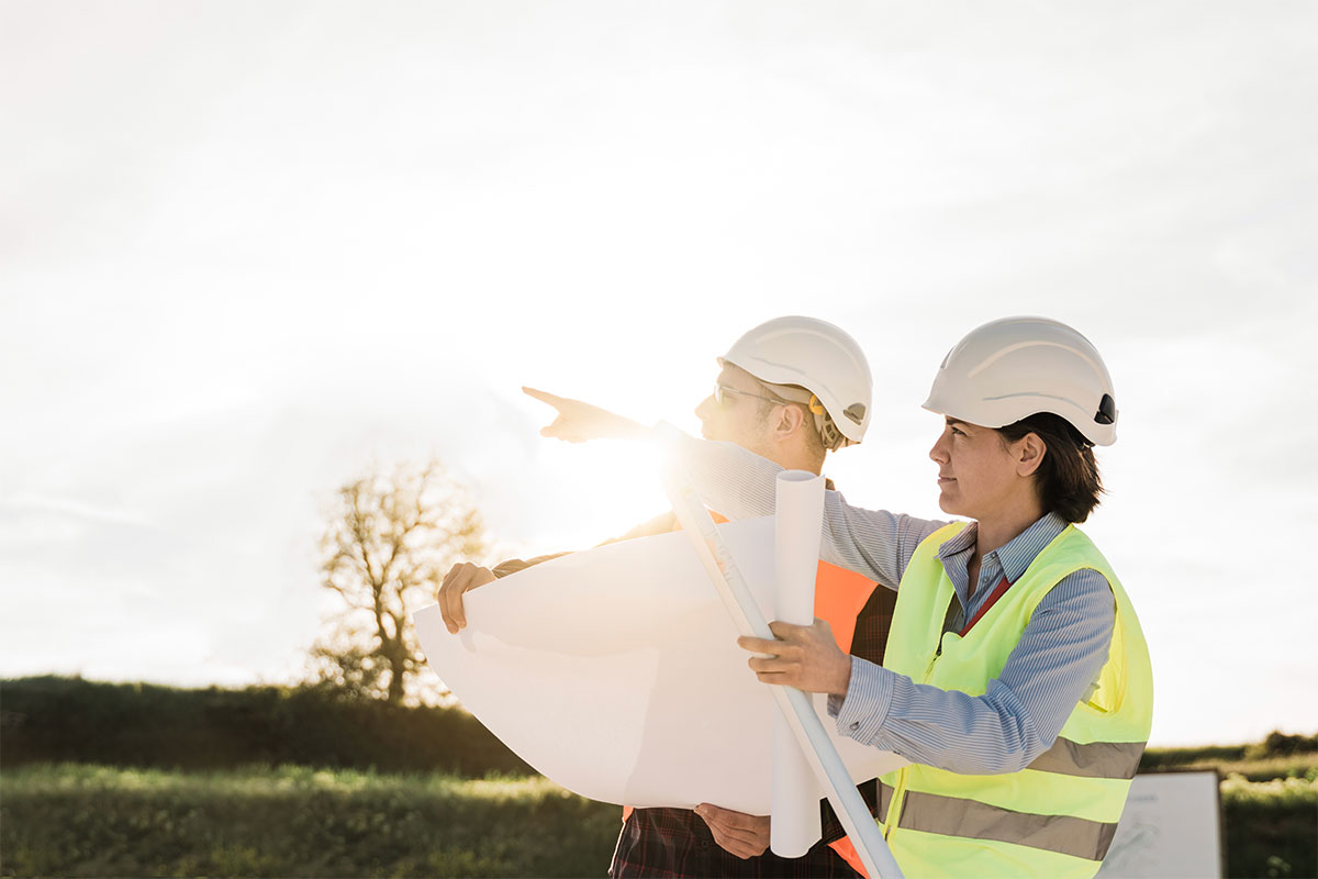 Two solar technicians discussing plans