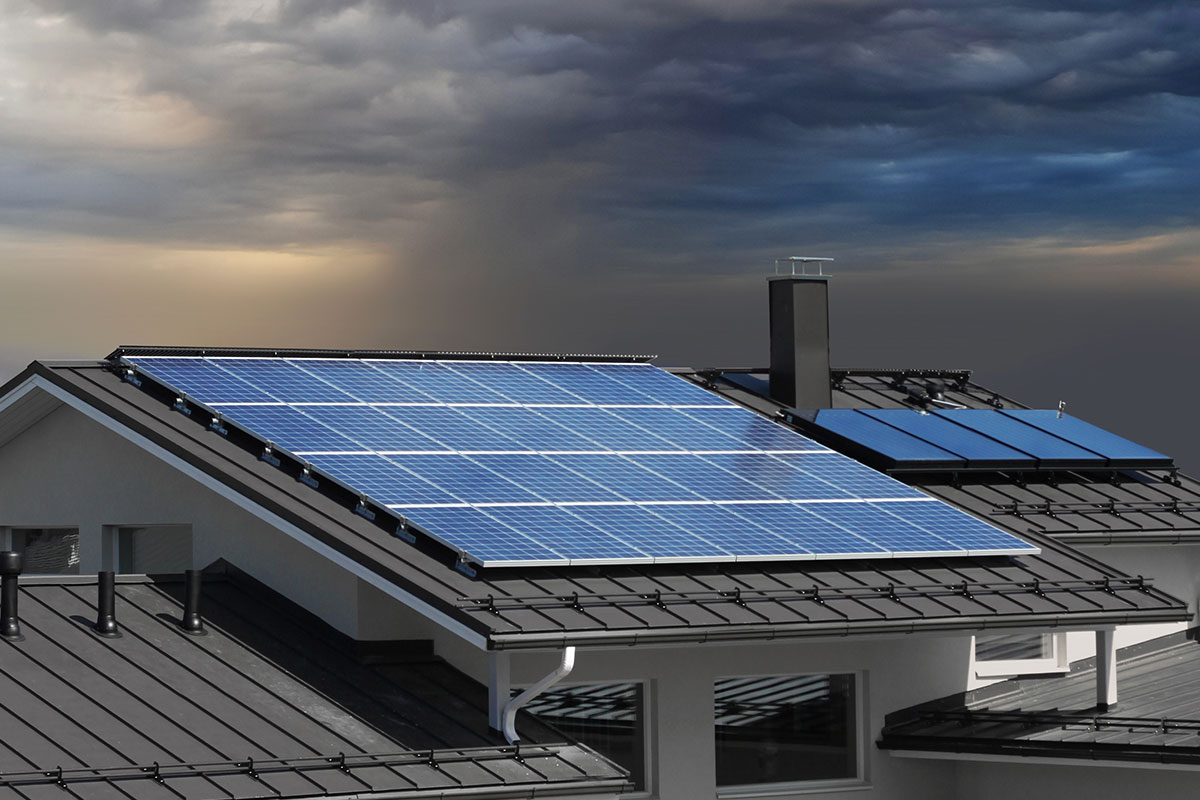 Solar panels on a residential home during a heavy storm