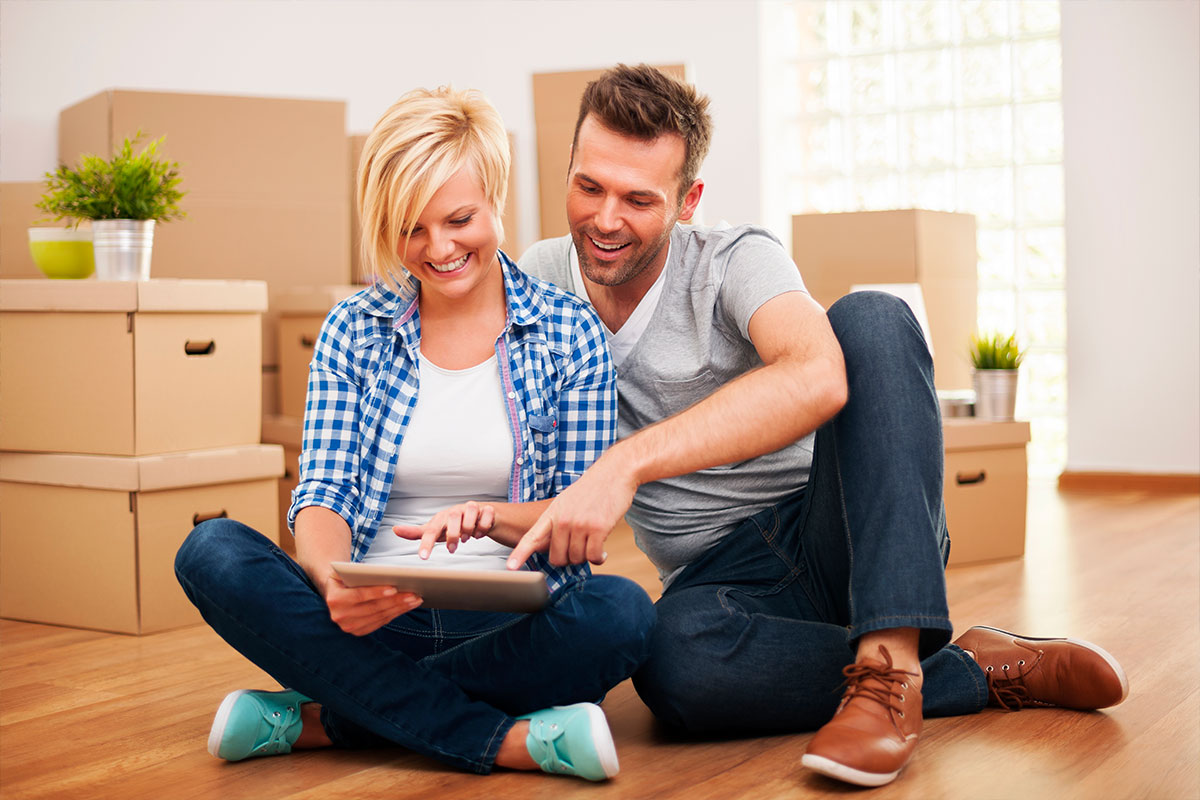 Young couple moving into a new home they've purchased