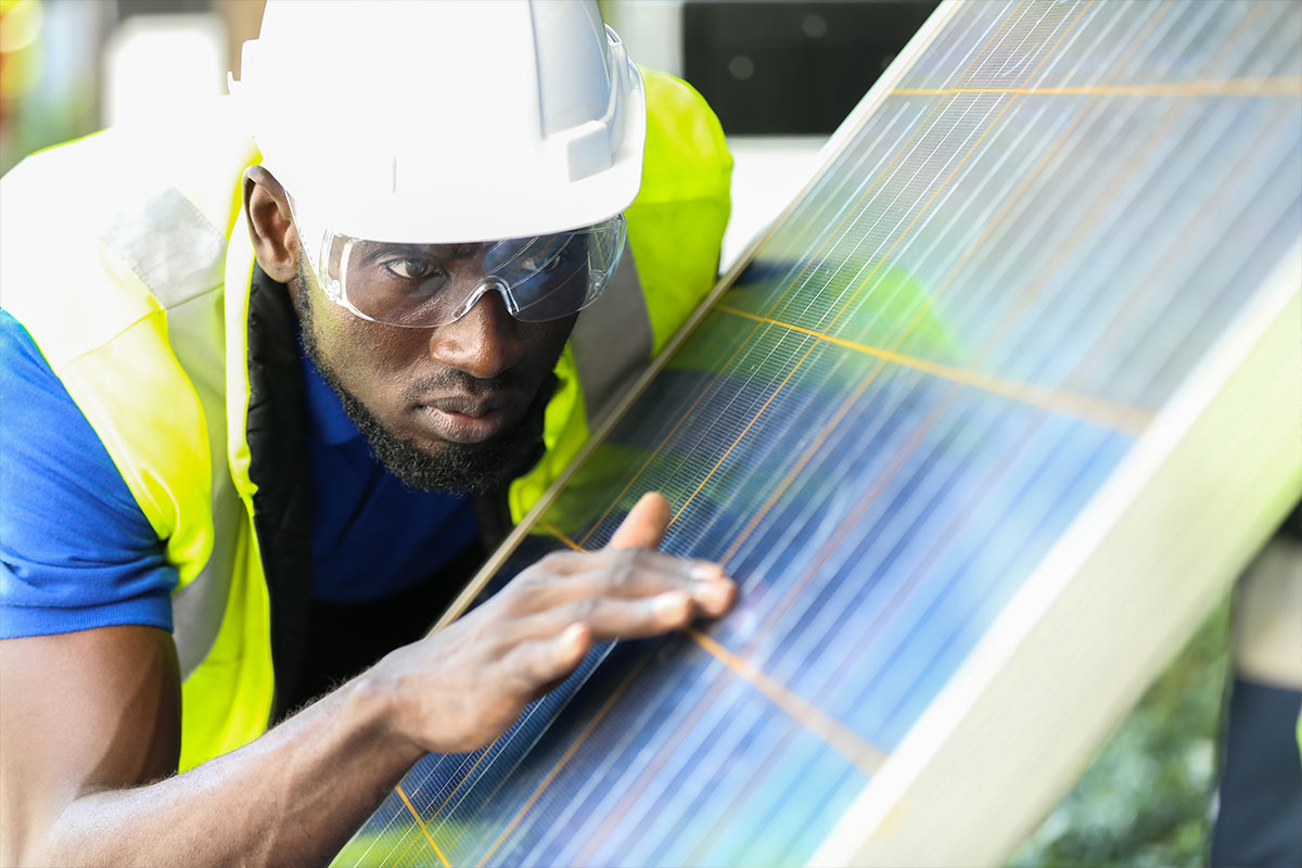 Solar maintenance engineer reviewing a new panel