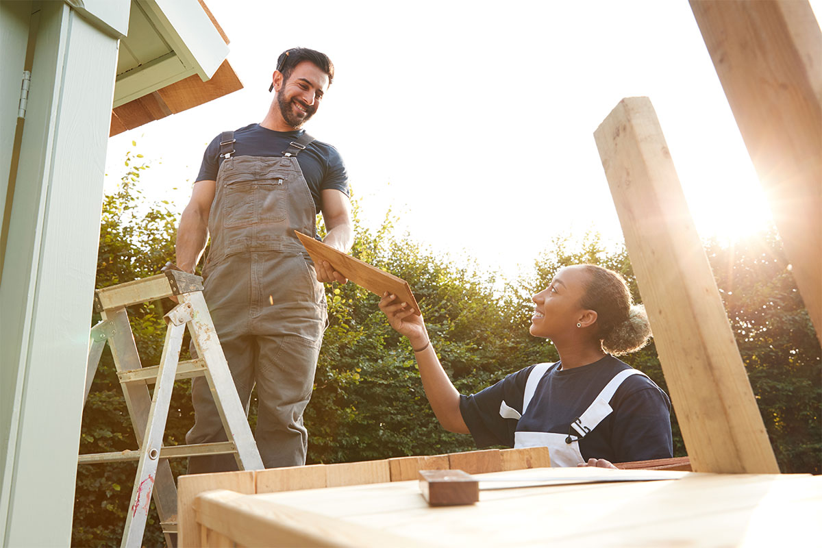 Young homeowner couple trying to install solar on their new home