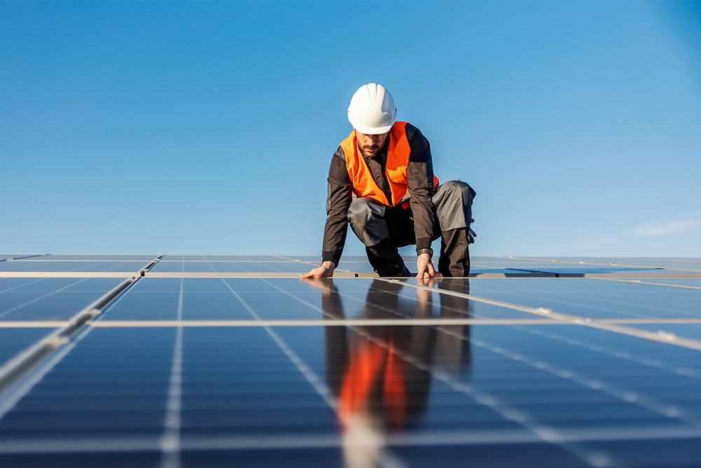 Man installing solar panels