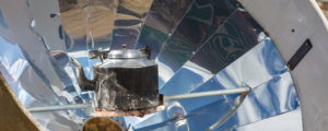 A solar cooker heating up a kettle