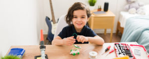 Child working a solar STEM project