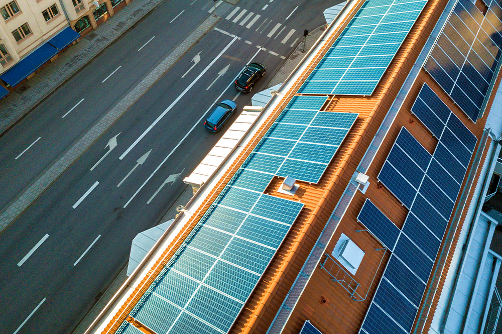 Many solar panels on a rooftop