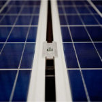 Close up of clean, blue on white solar panels