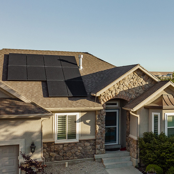 Modern, suburban home with black on black rooftop solar panels